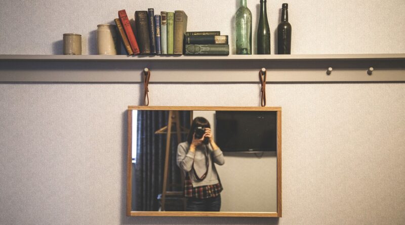 people, woman, frame, camera, shutter, aperture, iso, mirror, wall, books, brown book, brown books, brown camera, brown frame, brown mirror, people, frame, frame, aperture, iso, iso, iso, mirror, mirror, mirror, mirror, mirror