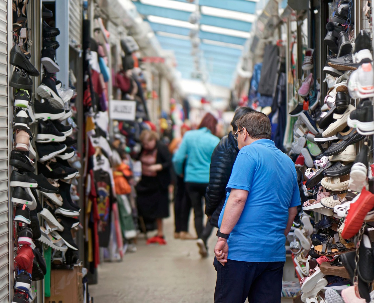 people, man, visiting, bazaar, goods, shoes, merchandise, for sale, commercial